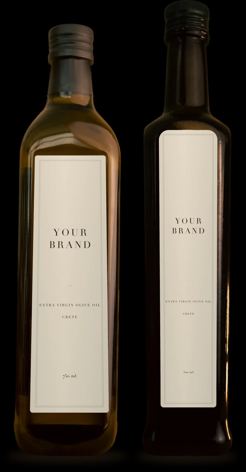 Two of the house's own bottles, a 750 ml marasca and a slim 500 ml, each with a blank cream label that reads Your Brand: the glass a private-label run is filled into.